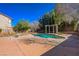 Backyard view of the private pool, patio area and mature trees at 3034 Scenic Valley Way, Henderson, NV 89052