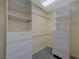 Walk-in closet features built-in shelving and drawers, as well as hanging rods for ample storage at 3034 Scenic Valley Way, Henderson, NV 89052