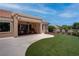 Relaxing covered patio area with comfortable seating, ideal for enjoying the beautifully landscaped backyard at 3040 Hidden Treasure Dr, Las Vegas, NV 89134