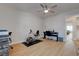 Bright bedroom featuring a ceiling fan, stationary bike, desk, and keyboard at 3040 Hidden Treasure Dr, Las Vegas, NV 89134