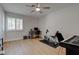 Spare bedroom with a ceiling fan, large window, and home gym equipment at 3040 Hidden Treasure Dr, Las Vegas, NV 89134