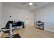 Bedroom with a ceiling fan, exercise equipment, keyboard, and small bookcase at 3040 Hidden Treasure Dr, Las Vegas, NV 89134