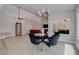 Bright dining area with modern chandelier, ceiling fan, and views into the living room at 3040 Hidden Treasure Dr, Las Vegas, NV 89134