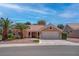 Charming single-story home featuring a tile roof, desert landscaping, and a two-car garage at 3040 Hidden Treasure Dr, Las Vegas, NV 89134