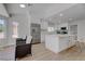Modern kitchen featuring a center island, stainless steel appliances, and sleek white cabinets at 3040 Hidden Treasure Dr, Las Vegas, NV 89134