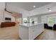 Open kitchen with a large island flowing into the living area, offering great views at 3040 Hidden Treasure Dr, Las Vegas, NV 89134