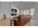 Comfortable living room features hardwood floors, a modern fireplace, and ample natural light at 3040 Hidden Treasure Dr, Las Vegas, NV 89134