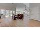 Expansive living room showcases hardwood floors, backyard access, and seamless flow to the kitchen at 3040 Hidden Treasure Dr, Las Vegas, NV 89134