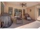 Covered patio with comfortable seating arrangement, ideal for outdoor dining and relaxation at 3040 Hidden Treasure Dr, Las Vegas, NV 89134