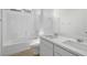 Bright bathroom with a double sink vanity, large mirror, and a shower-tub combo for a relaxing space at 328 Taylor St, Henderson, NV 89015