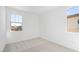Bright bedroom with plush carpet, neutral walls, and multiple windows at 328 Taylor St, Henderson, NV 89015