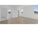 Spacious bonus room with wood-look tile floors, large windows, and ample natural light at 328 Taylor St, Henderson, NV 89015