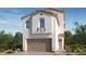 Stunning two-story home featuring a Spanish colonial revival architectural style, complemented by lush landscaping at 328 Taylor St, Henderson, NV 89015