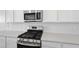 Modern kitchen featuring stainless steel appliances, white cabinetry, and light countertops at 328 Taylor St, Henderson, NV 89015
