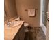 Bathroom features a white sink with marble countertops, toilet, and combination shower-bathtub at 3382 Berwyck St, Las Vegas, NV 89121