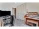 Bedroom features a closet with folding doors, organ, and desk at 3382 Berwyck St, Las Vegas, NV 89121