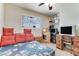 Bedroom features a ceiling fan, window with horizontal blinds, and a bed with floral pattern bedding at 3382 Berwyck St, Las Vegas, NV 89121
