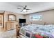 Bedroom features a ceiling fan, window, and quilted bedspread at 3382 Berwyck St, Las Vegas, NV 89121