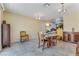Charming dining area featuring a wooden table and chairs, with elegant lighting fixtures at 3382 Berwyck St, Las Vegas, NV 89121