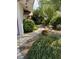 Front yard with garden and walkway leading to the front door at 3382 Berwyck St, Las Vegas, NV 89121