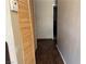 Hallway with dark wood floors and paneled closet doors leading to other rooms at 3382 Berwyck St, Las Vegas, NV 89121