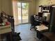 Office with sliding glass door features computer desk, computer tower, and backyard views at 3382 Berwyck St, Las Vegas, NV 89121