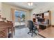 Bright home office with sliding door to backyard access with a view of the pool at 3382 Berwyck St, Las Vegas, NV 89121