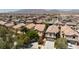 Expansive aerial view of a residential neighborhood, showcasing neat rows of houses and community layout at 3404 Brayton Mist Dr, North Las Vegas, NV 89081