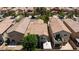 Backyard aerial view with maintained lawn, patio and landscaping, offering privacy and outdoor living at 3404 Brayton Mist Dr, North Las Vegas, NV 89081