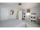 Neutral-toned bedroom featuring white built-in bookcases for ample storage, plus a cozy bed and carpet at 3404 Brayton Mist Dr, North Las Vegas, NV 89081