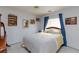 Cozy bedroom featuring plush carpet, great light, and a comfortable bed at 3404 Brayton Mist Dr, North Las Vegas, NV 89081
