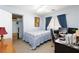 Bedroom with carpet flooring, a ceiling fan, a window with curtains, and closet with some items at 3404 Brayton Mist Dr, North Las Vegas, NV 89081
