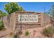 Elegant stone community sign for Shadow Springs, showcasing a welcoming entrance at 3404 Brayton Mist Dr, North Las Vegas, NV 89081