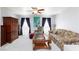 Cozy living room with plush carpet, ceiling fan, and floral patterned sofa and chair for comfortable living at 3404 Brayton Mist Dr, North Las Vegas, NV 89081