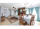 Bright and airy living room with a fireplace and a dining area at 3404 Brayton Mist Dr, North Las Vegas, NV 89081