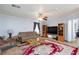 Comfortable living room with a ceiling fan and a large area rug at 3404 Brayton Mist Dr, North Las Vegas, NV 89081
