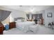 Spacious main bedroom featuring a comfortable king bed and soft natural light at 3404 Brayton Mist Dr, North Las Vegas, NV 89081