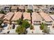 A street view featuring neat houses with well-maintained yards and driveways in a suburban neighborhood at 3404 Brayton Mist Dr, North Las Vegas, NV 89081