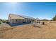 Desert home featuring solar panels, covered patio and gazebo in the spacious backyard at 3430 Flagstone Ct, Pahrump, NV 89048