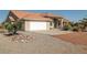 Charming single-story home featuring a spacious driveway and an attached two-car garage at 3430 Flagstone Ct, Pahrump, NV 89048