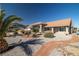 Charming single-story home featuring desert landscaping, a spacious driveway, and a tiled roof at 3430 Flagstone Ct, Pahrump, NV 89048