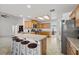 Open kitchen showcasing an island with seating, stainless steel appliances, and abundant cabinet space at 3430 Flagstone Ct, Pahrump, NV 89048