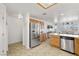 Spacious kitchen with stainless steel appliances, wooden cabinetry, and a dining area at 3430 Flagstone Ct, Pahrump, NV 89048