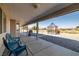 Covered patio with grill, decorative gazebo and chairs overlooking desert landscape at 3430 Flagstone Ct, Pahrump, NV 89048