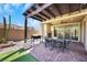 Backyard features patio, pergola, outdoor grill, and artificial turf at 3512 Portiani Dr, Las Vegas, NV 89141