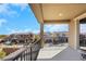 Relaxing balcony featuring views of neighboring homes and blue skies at 3512 Portiani Dr, Las Vegas, NV 89141