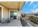 Cozy balcony space with comfortable seating and a view of the nearby hills and houses at 3512 Portiani Dr, Las Vegas, NV 89141