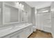 Modern bathroom features double sinks, white cabinets, and a shower-tub combo at 3512 Portiani Dr, Las Vegas, NV 89141