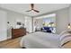 Bright, spacious bedroom with wood floors, desk/vanity and seating area at 3512 Portiani Dr, Las Vegas, NV 89141
