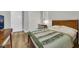 Bedroom featuring natural light, hardwood floors and a workspace at 3512 Portiani Dr, Las Vegas, NV 89141